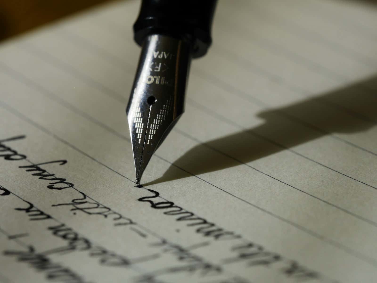 Fountain pen on a handwritten page